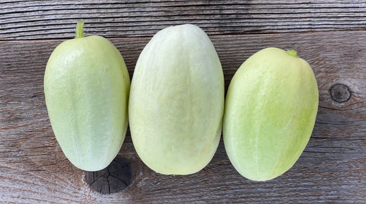 dragons egg cucumbers on wooden backdrop